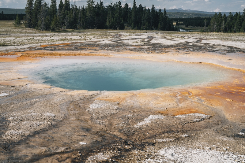 Turquoise Hot Spring With Mineral Deposits