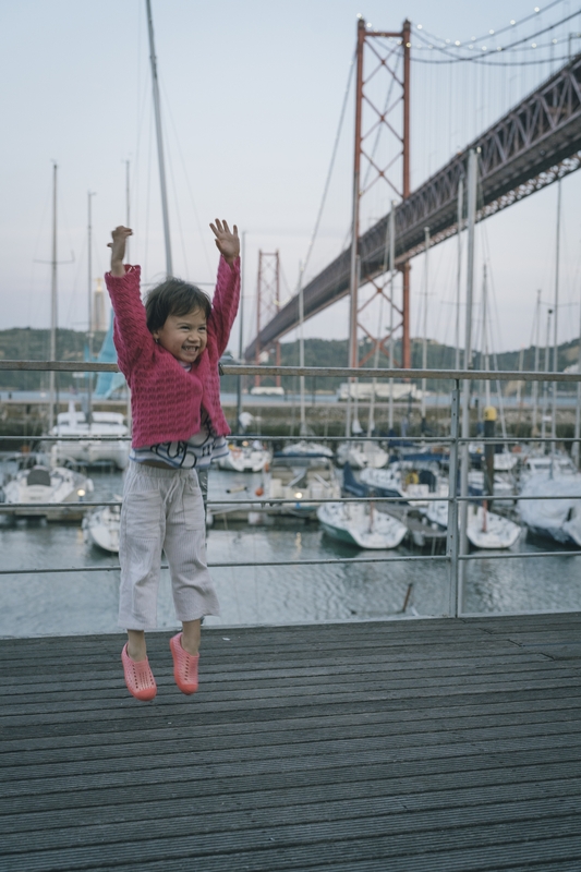 Lulu At Lisbon's Marina, Arms Raised