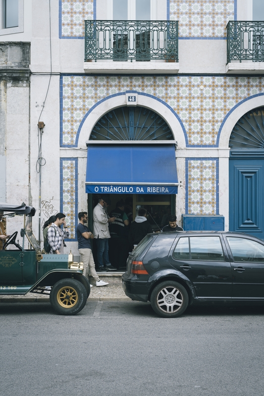 Portuguese Tile Building with Street Activity